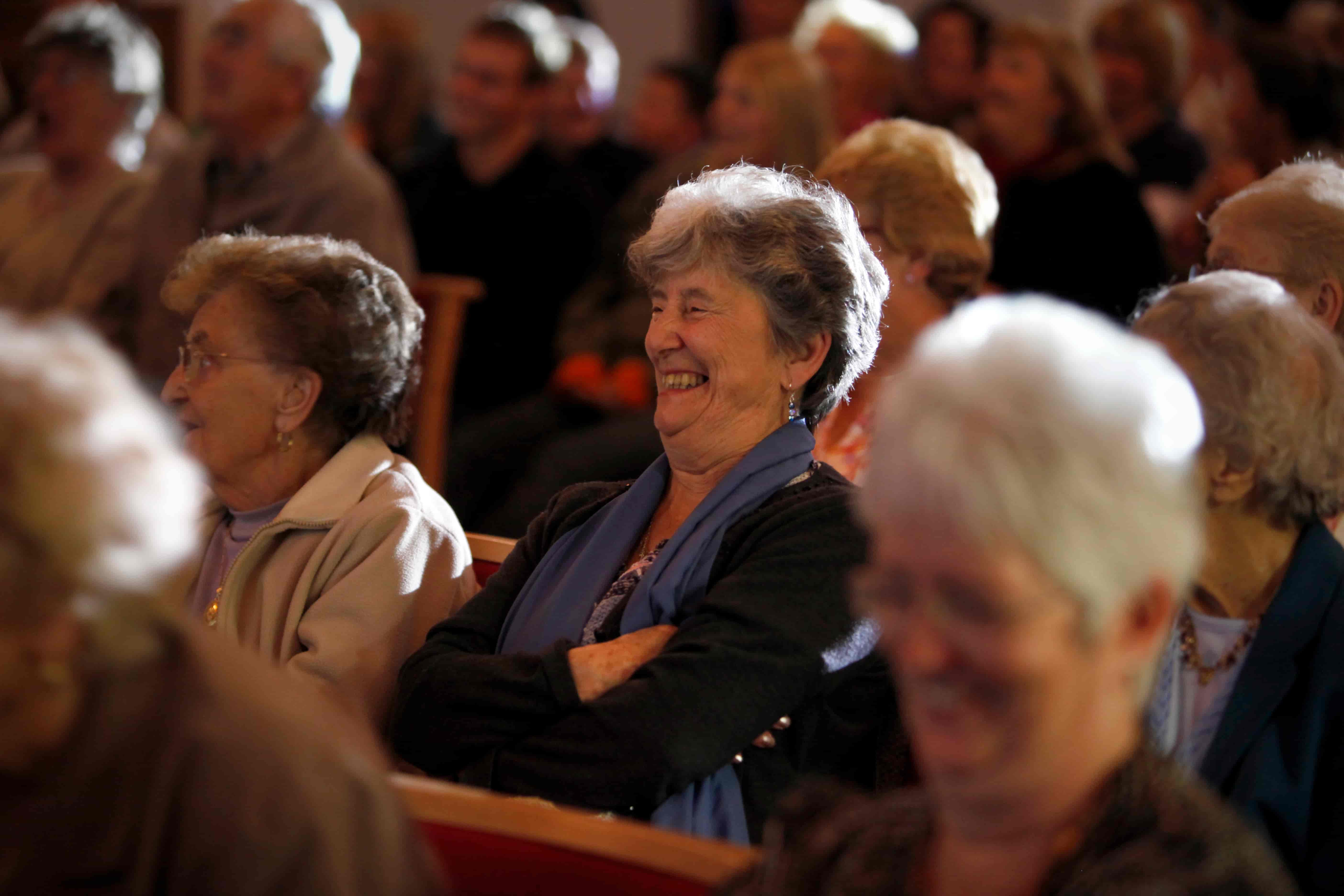 Image: Woman Laughing in audience watching a show