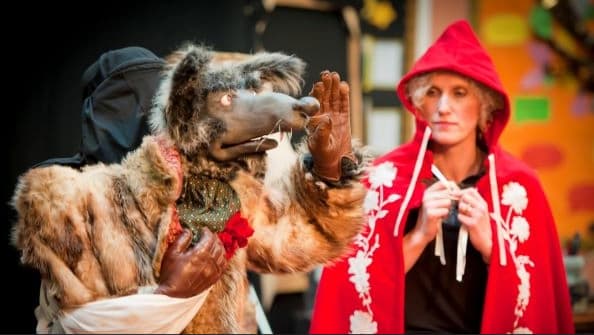 Llun/Image: Wolf puppet and lady in red cape Photo Credit Karl Baker