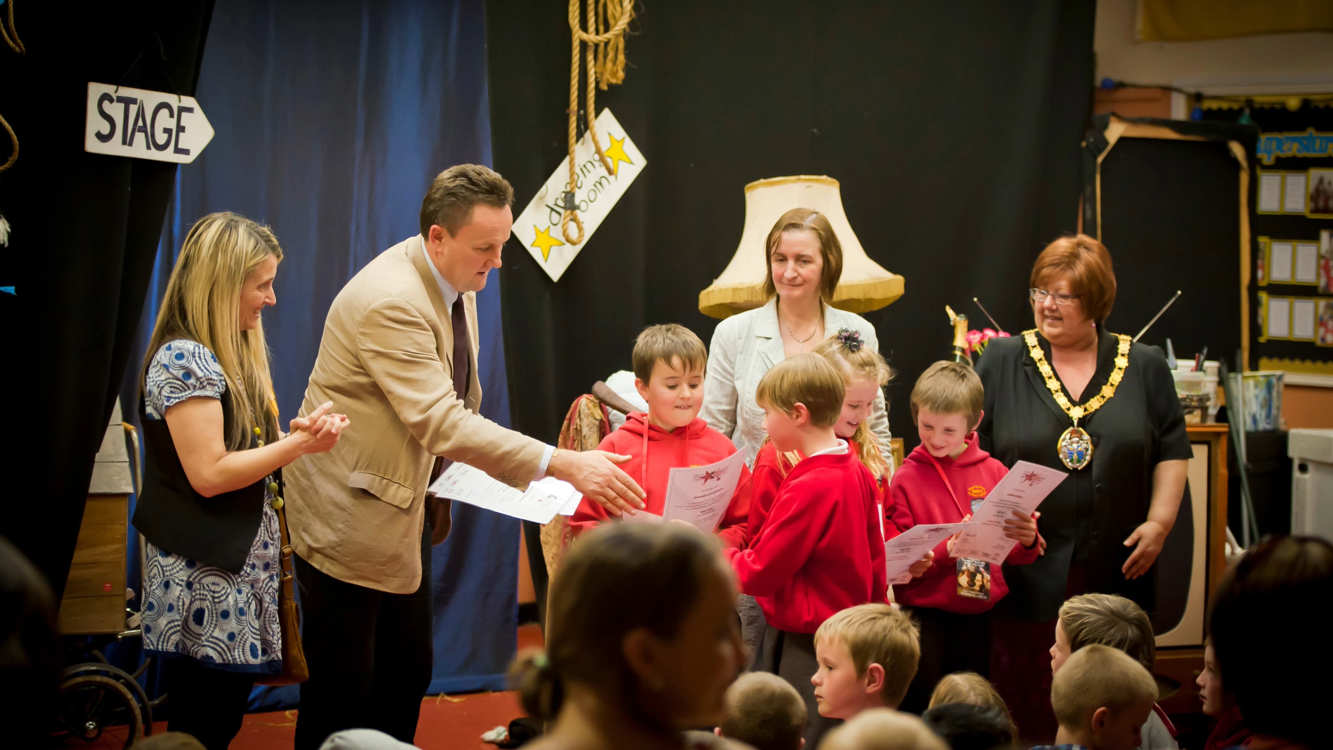 Llun/Image: Children receiving Certificates Photo Credit: Karl Baker